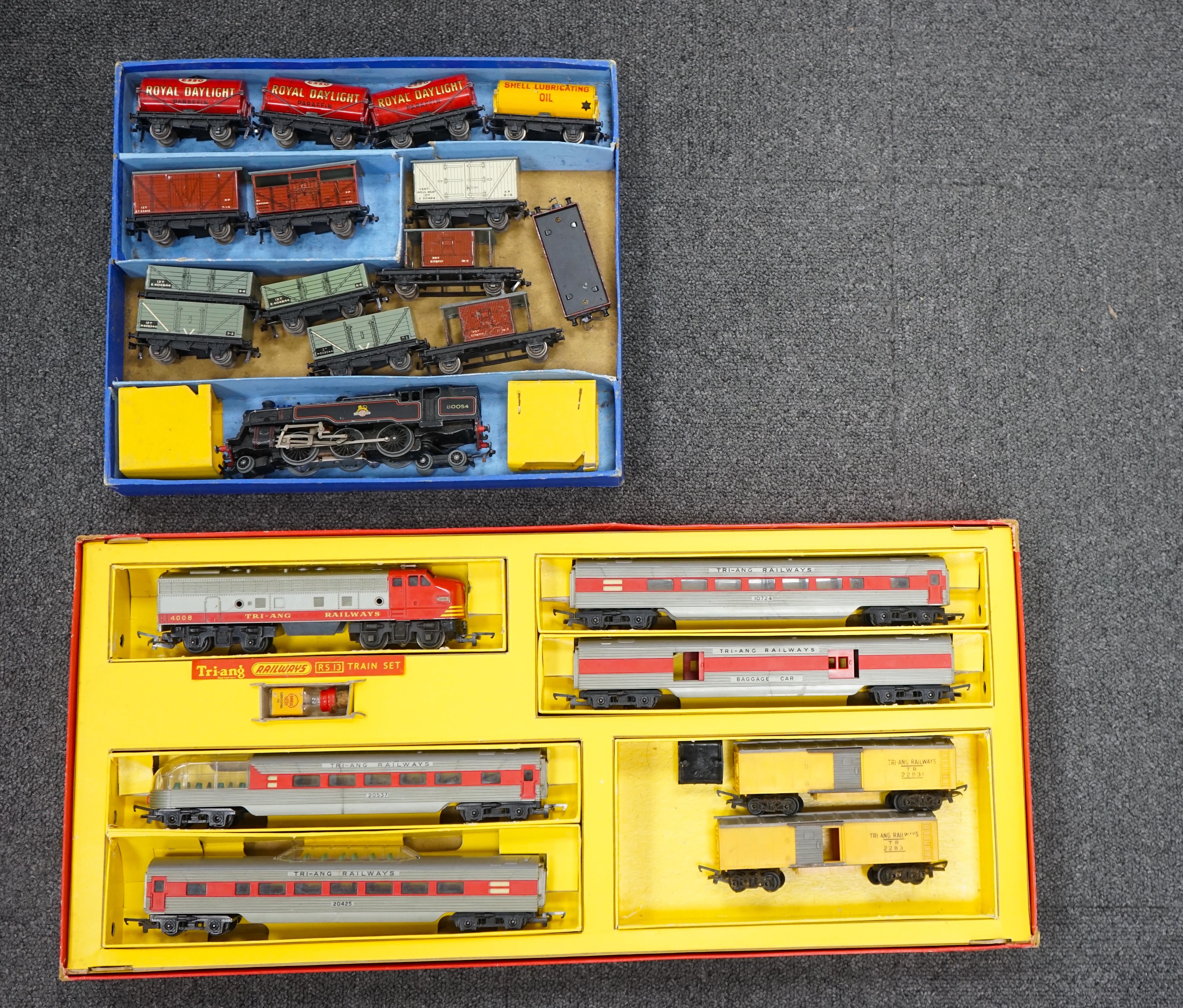 A collection of Hornby Dublo and Tri-ang Railways 00 gauge railway contained within two original boxes; a Hornby Dublo EDG17 Tank Goods Train B.R. set, contents include a BR Standard Class 4, 80054, fourteen tinplate fre